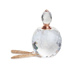 Photo of Glass bottle of perfume and luxury jewellery isolated on white