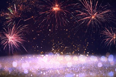 Image of 4th of July - Independence Day of USA. Festive background with fireworks and glitters, bokeh effect