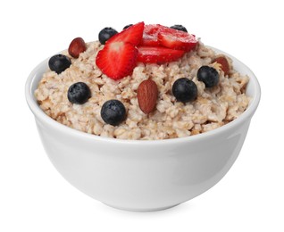 Photo of Tasty boiled oatmeal with berries and almonds in bowl isolated on white