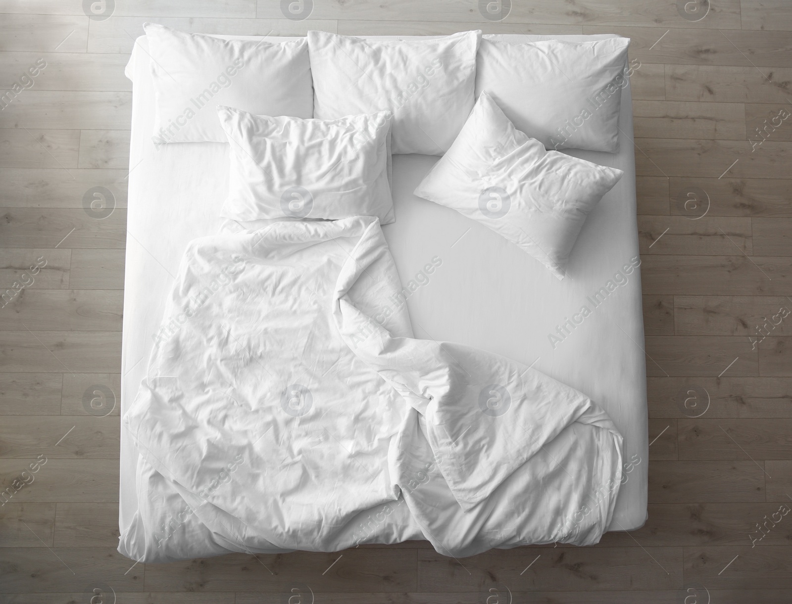 Photo of Comfortable bed with soft pillows indoors, top view