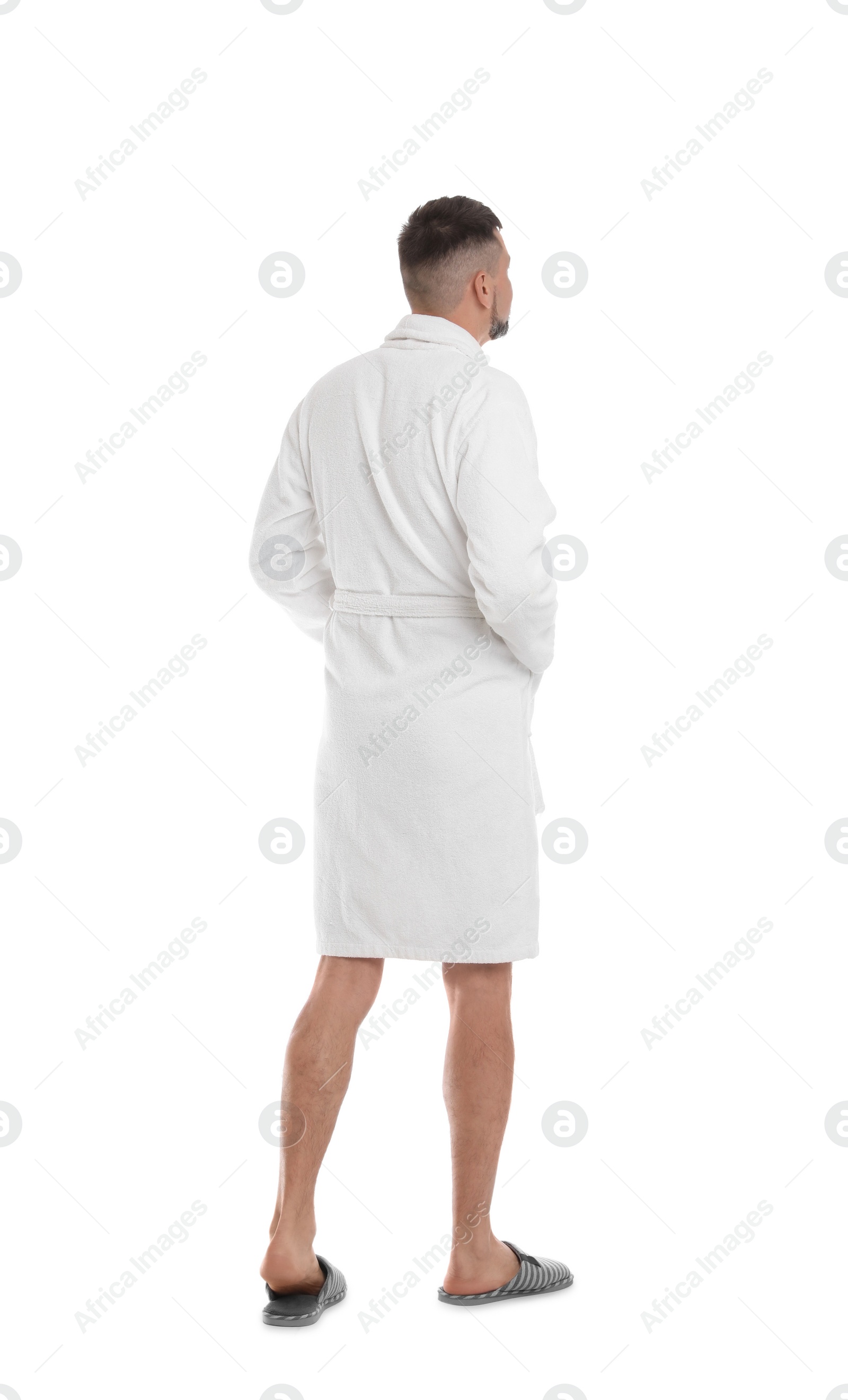 Photo of Man wearing bathrobe and slippers on white background