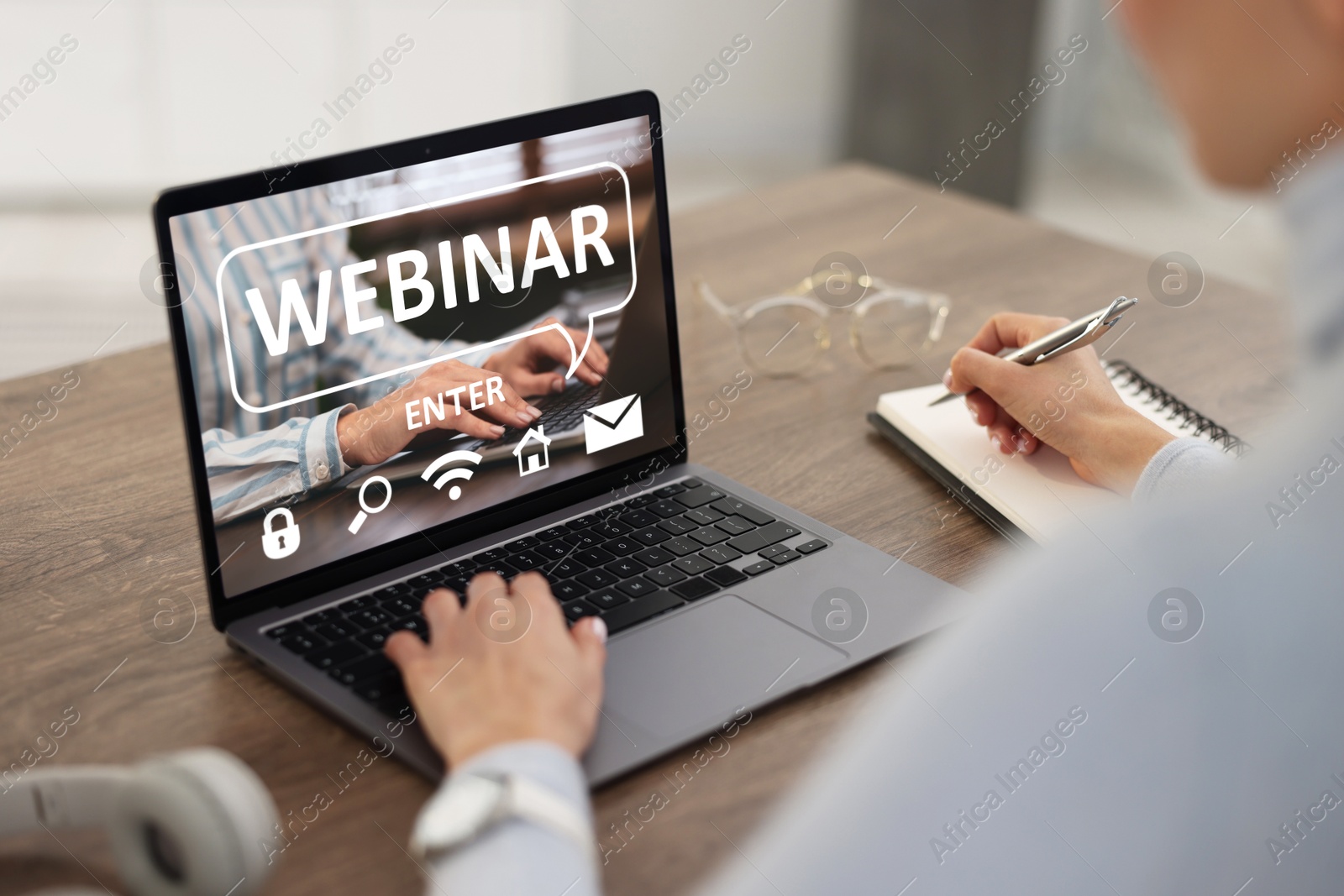 Image of Webinar. Woman using laptop at table, closeup