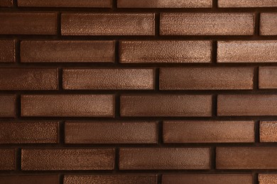 Photo of Texture of brown brick wall as background