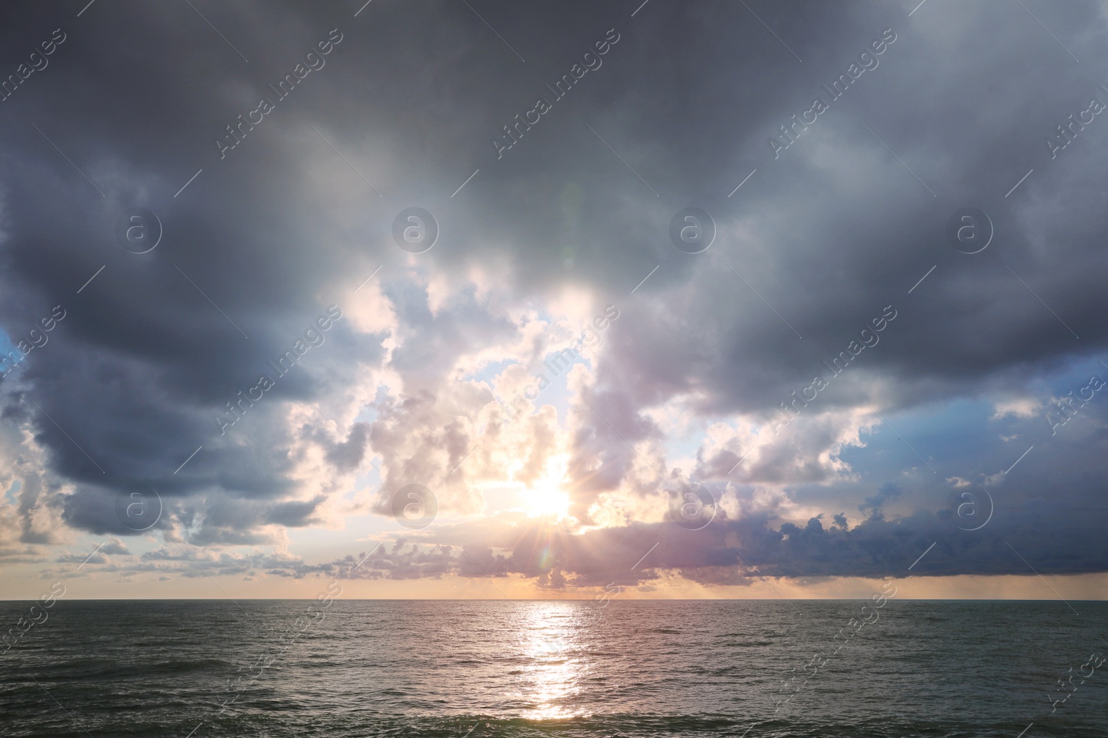 Photo of Picturesque view of sky with heavy rainy clouds over sea