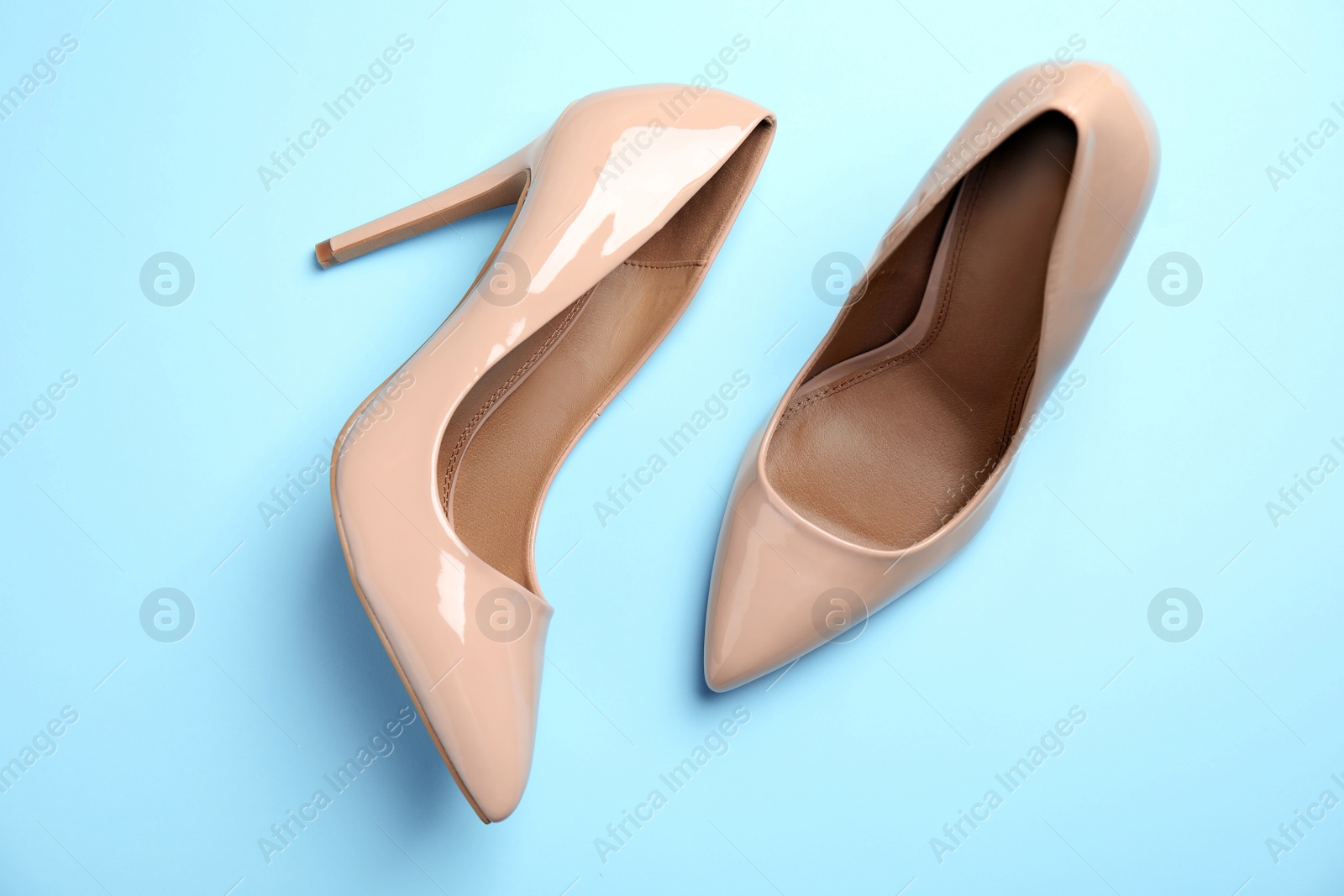 Photo of Pair of beautiful shoes on color background, top view