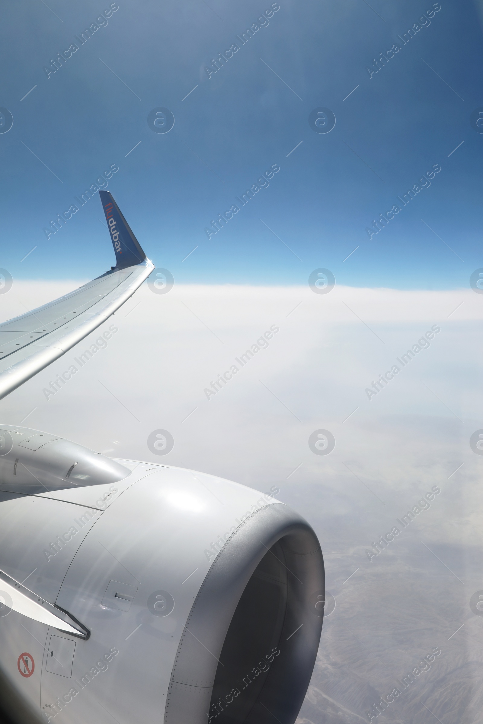 Photo of DUBAI, UNITED ARAB EMIRATES - NOVEMBER 06, 2018: Picturesque view of cloudy sky from Flydubai plane