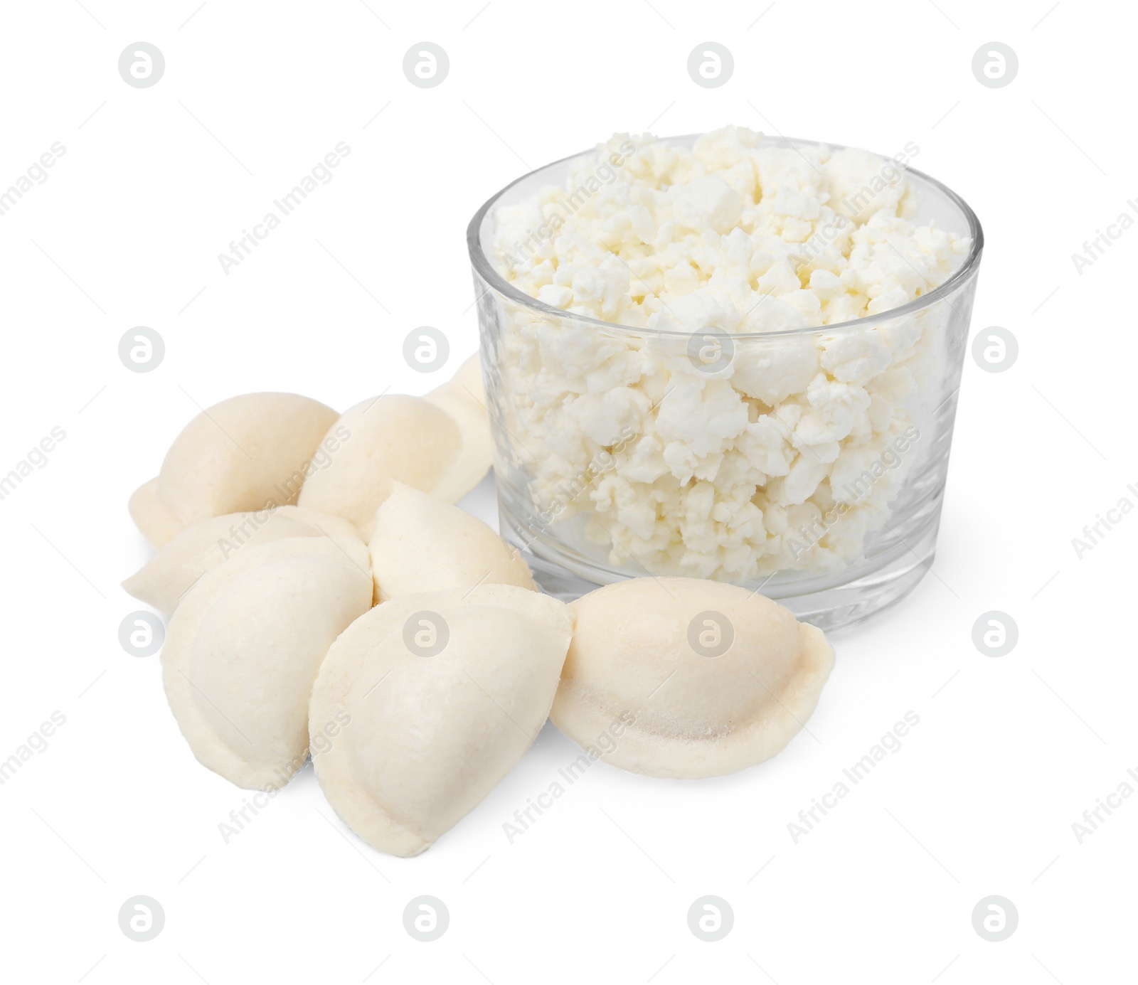 Photo of Raw dumplings (varenyky) and bowl with cottage cheese on white background