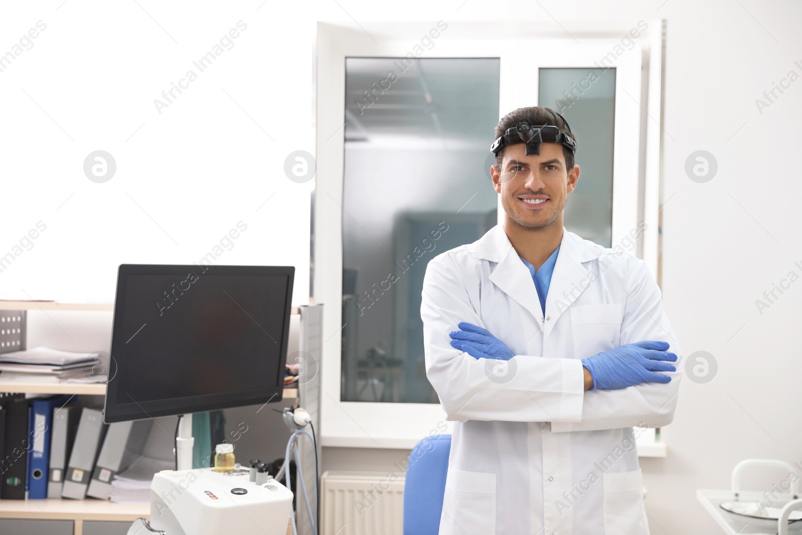 Photo of Portrait of professional surgeon in modern clinic. Space for text