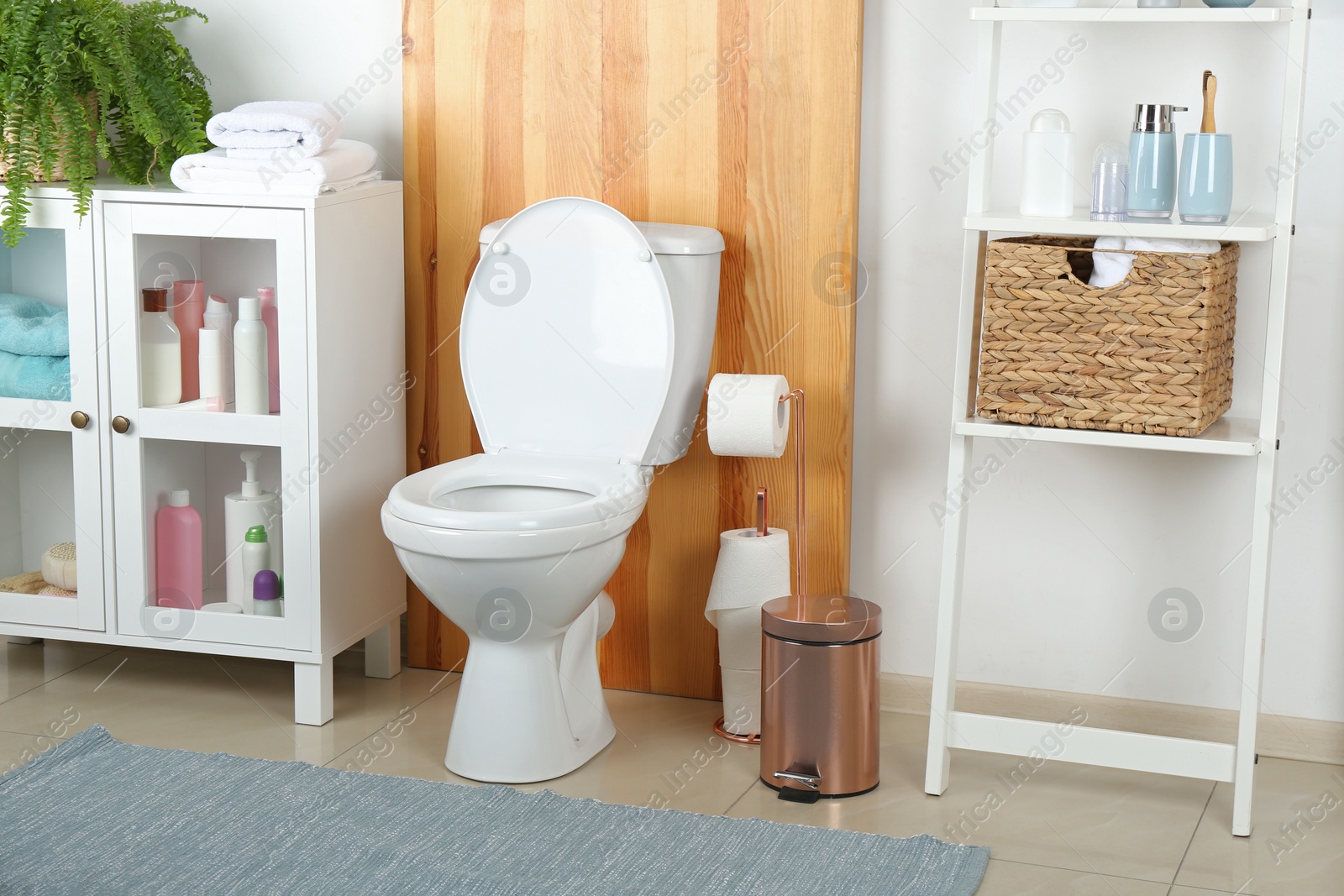 Photo of Stylish toilet bowl in modern bathroom interior