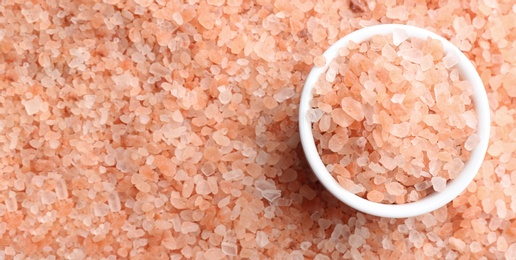 Photo of Pink himalayan salt and bowl as background, top view