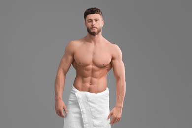 Photo of Handsome muscular man on grey background. Sexy body