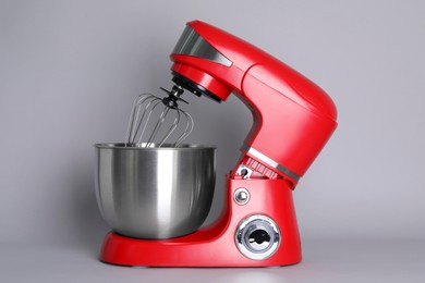 Modern red stand mixer on light gray background