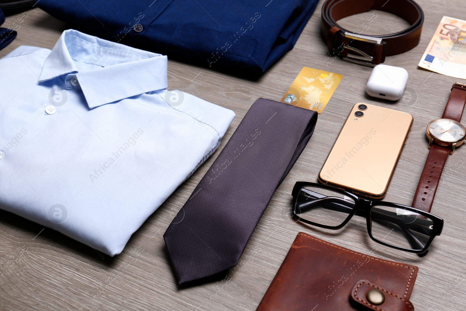 Photo of Composition with clothes and accessories on wooden background. Packing for business trip