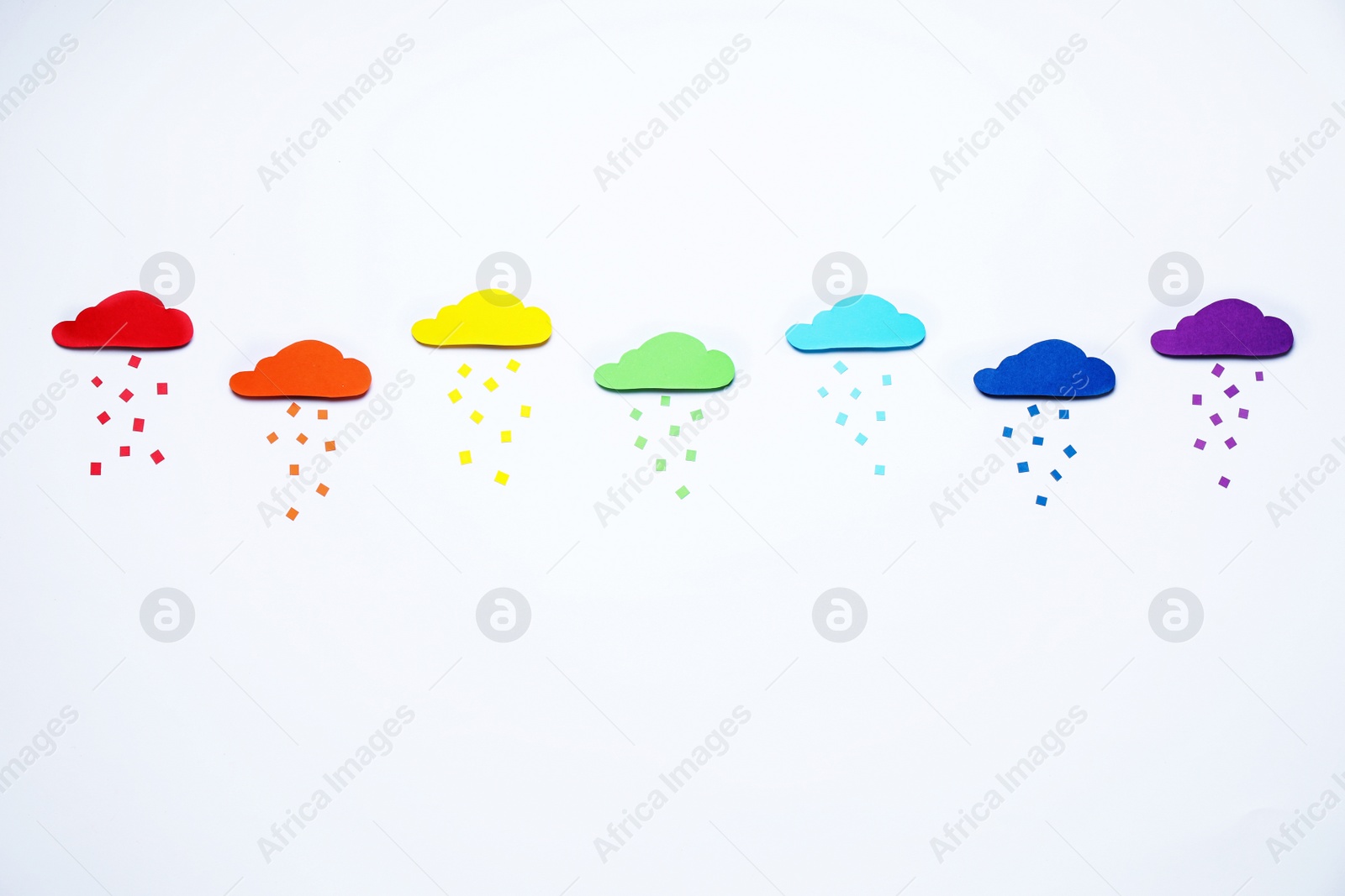 Photo of Bright clouds and rain made with colorful paper, top view. Rainbow palette