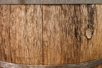 Traditional wooden barrel as background, closeup. Wine making