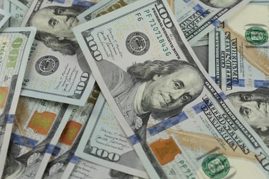 Photo of Money exchange. Dollar banknotes as background, closeup