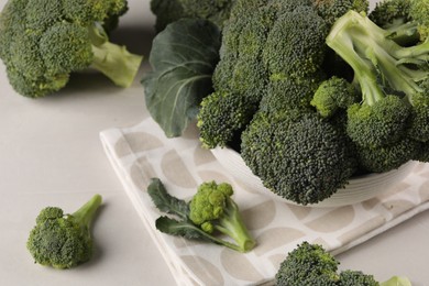 Fresh raw broccoli on white table, closeup