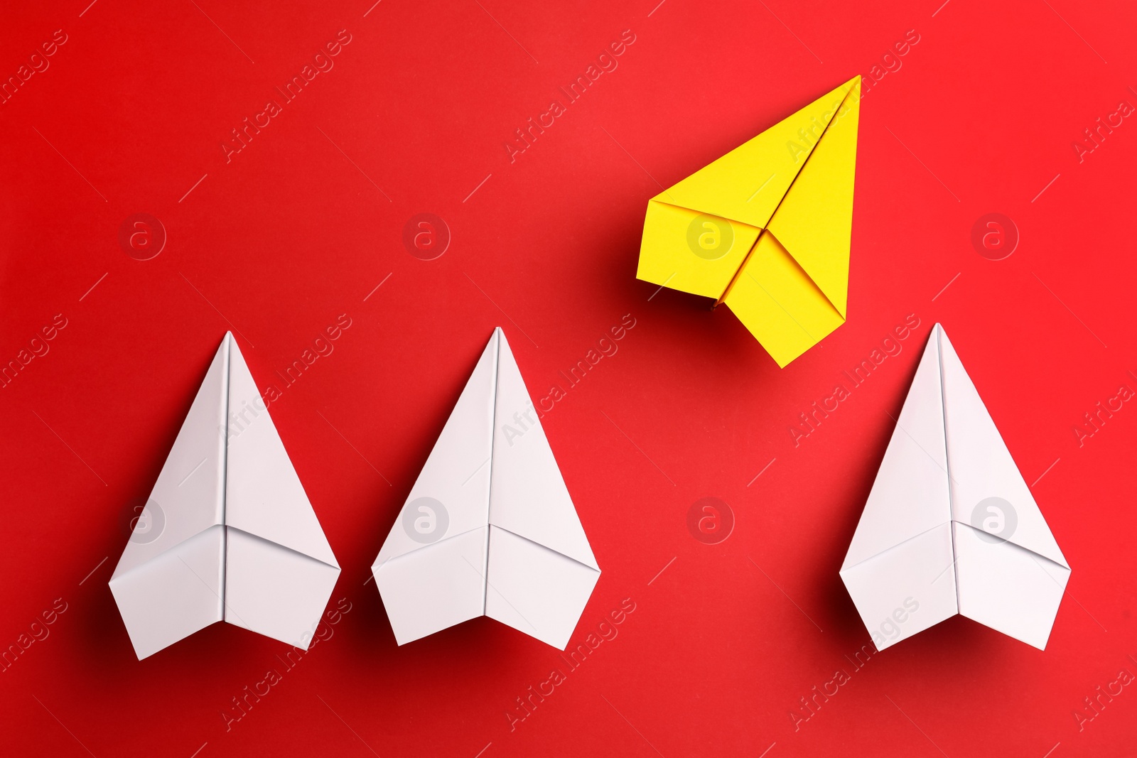 Photo of Flat lay composition with paper planes on red background