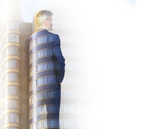 Image of Double exposure of businessman and office building