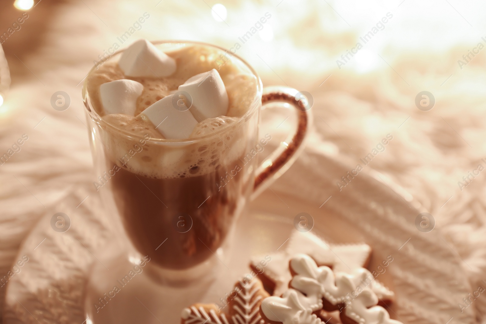 Photo of Cup of hot drink with marshmallows and cookies on plate, closeup. Christmas atmosphere