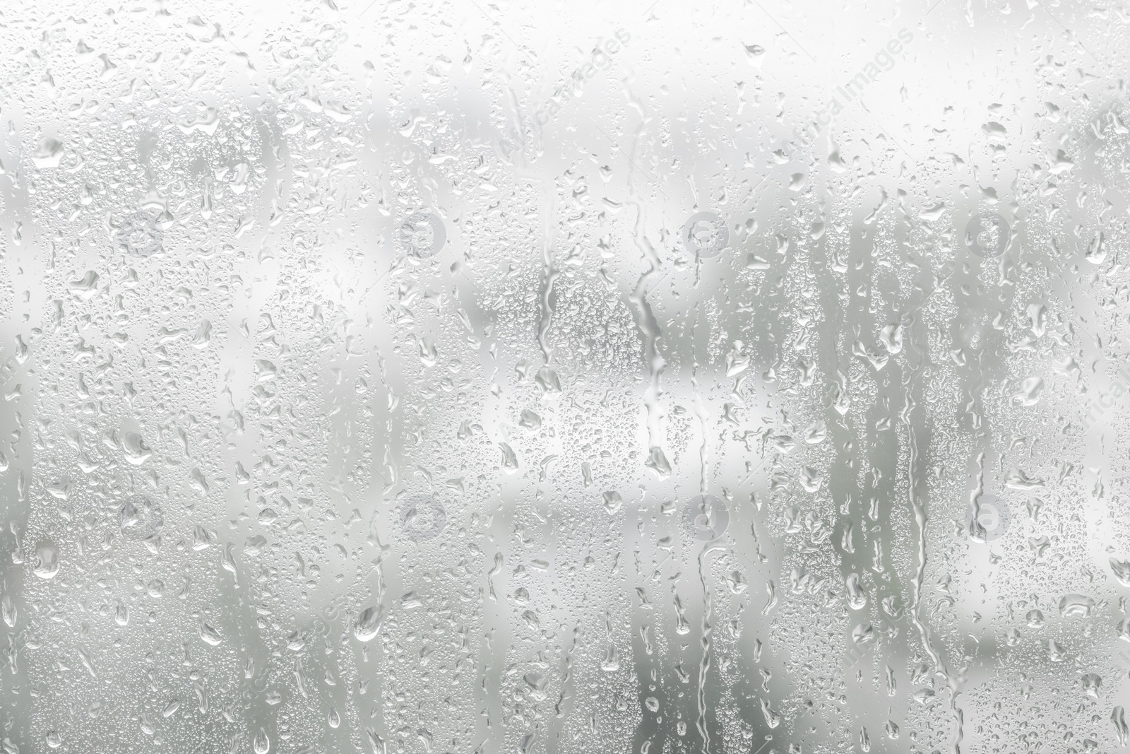 Image of Window glass with raindrops as background, closeup