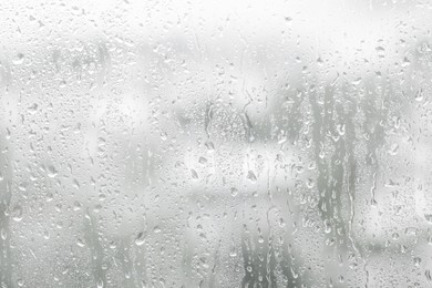 Window glass with raindrops as background, closeup