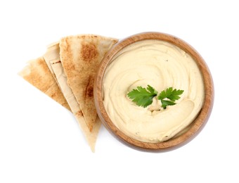 Photo of Delicious hummus with pita chips and parsley on white background, top view