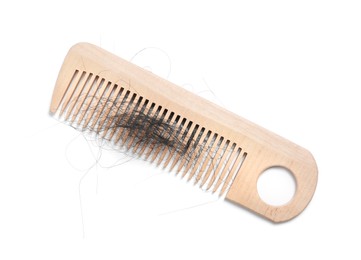 Wooden comb with lost hair on white background, top view