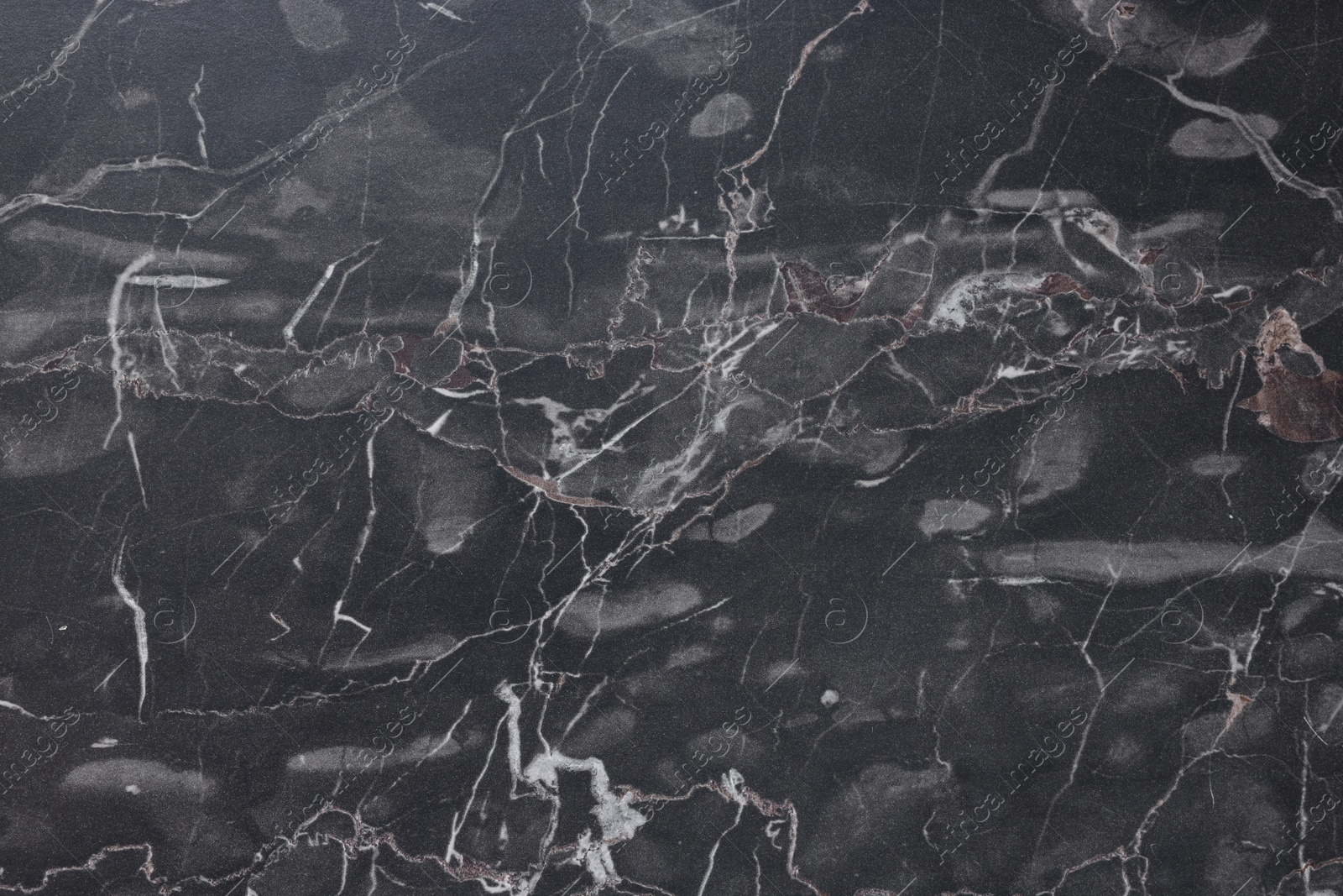 Photo of Dark grey marble surface as background, closeup