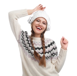 Young woman listening to music with headphones on white background