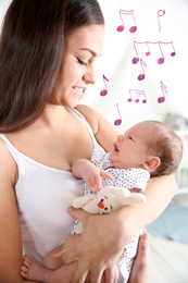 Flying music notes and young woman with her newborn baby on blurred background. Lullaby songs