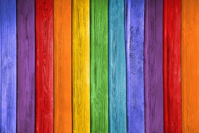 Image of Old wooden planks in rainbow colors as background
