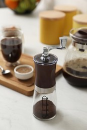 Photo of Manual coffee grinder on counter in kitchen