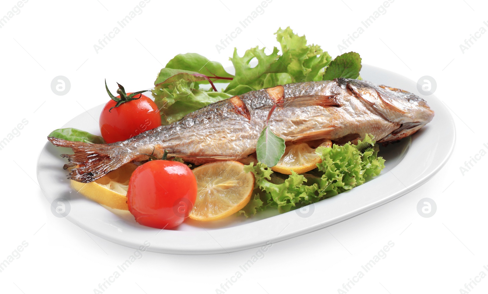 Photo of Delicious roasted fish with lemon and vegetables isolated on white