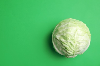 Ripe cabbage on color background, top view