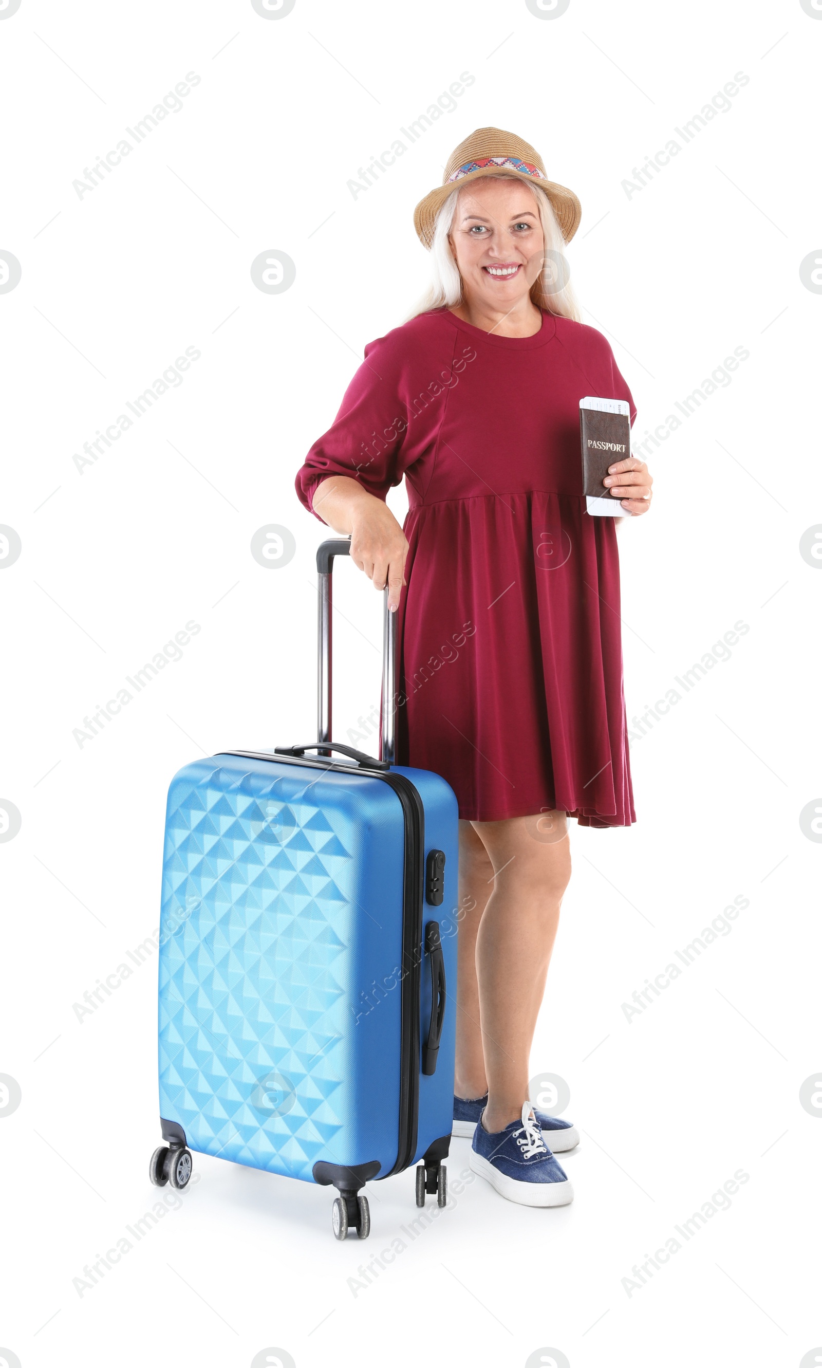 Photo of Senior woman with suitcase and passport on white background. Vacation travel