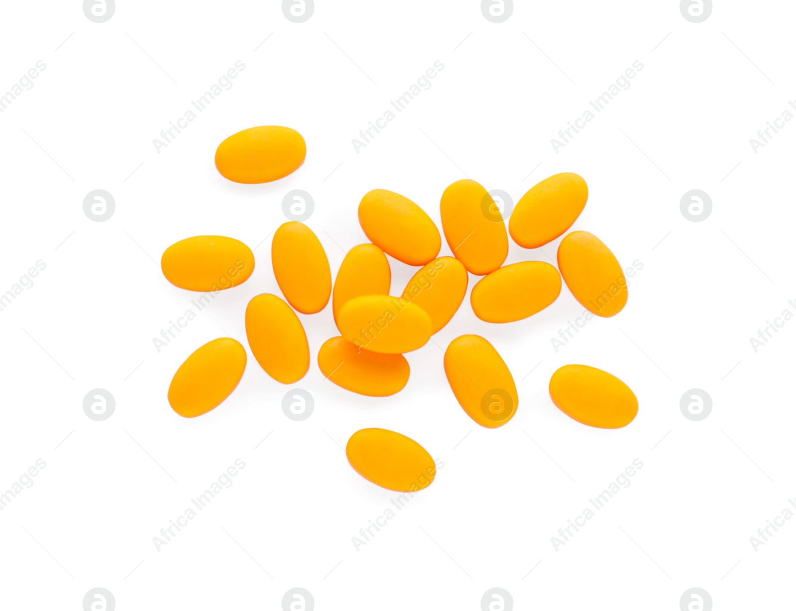 Photo of Tasty orange dragee candies on white background, top view