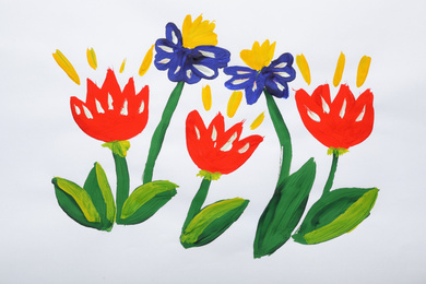 Photo of Child's painting of flowers on white paper