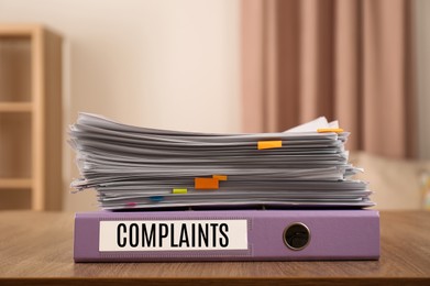 Image of Folder with Complaints label and documents on office desk