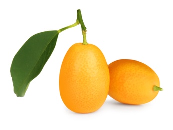 Photo of Fresh ripe kumquats with leaves on white background. Exotic fruit