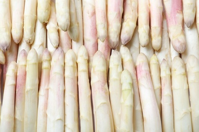 Photo of Fresh ripe white asparagus as background, top view
