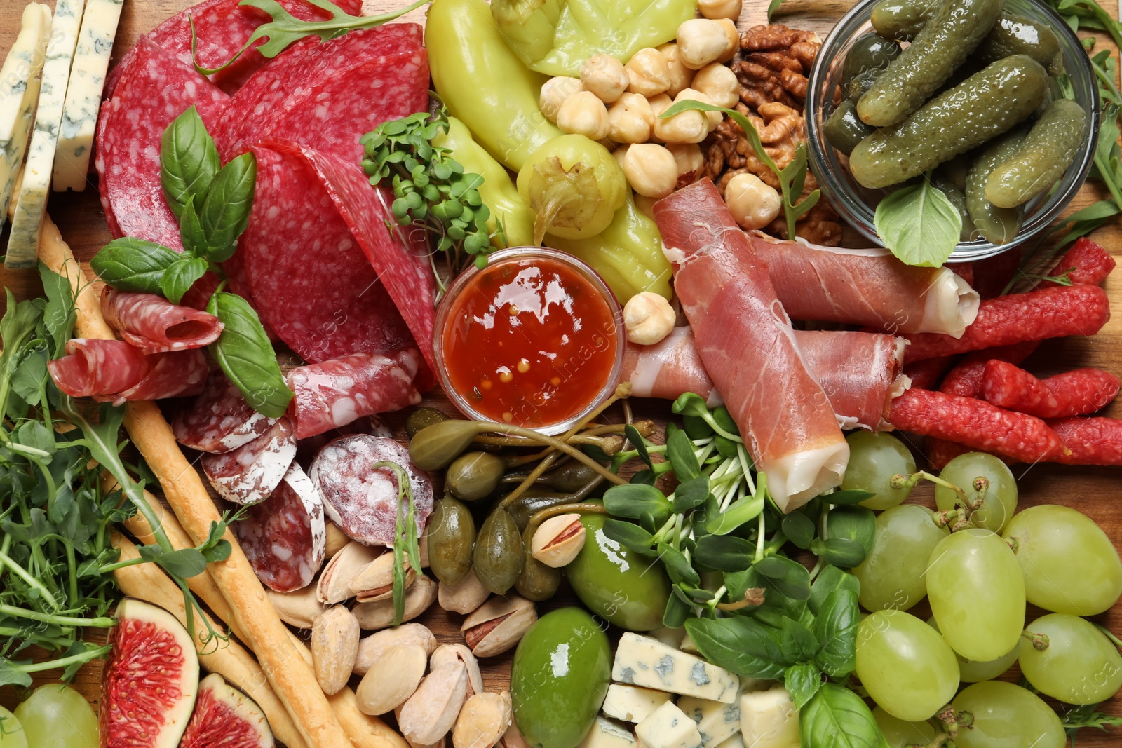 Photo of Set of different delicious appetizers as background, top view