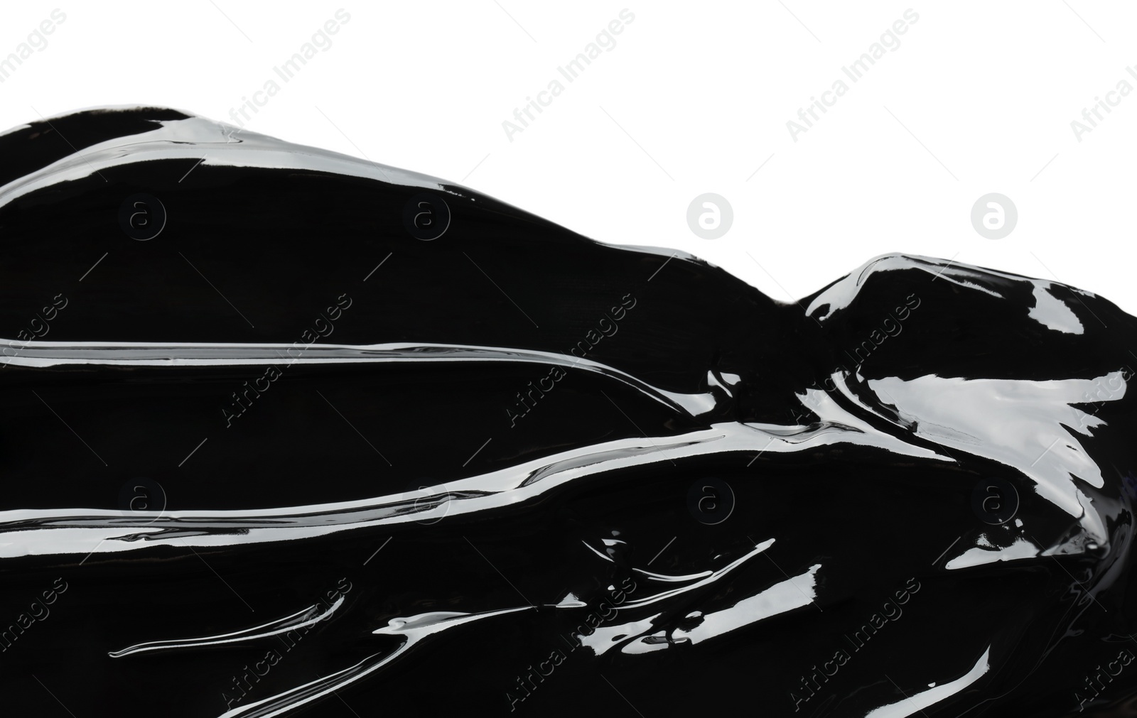 Photo of Blot of black glossy paint on white background, top view