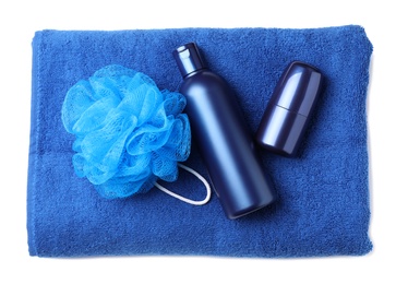 Photo of Shampoo, roller deodorant, towel and bast wisp isolated on white, top view. Men's cosmetics