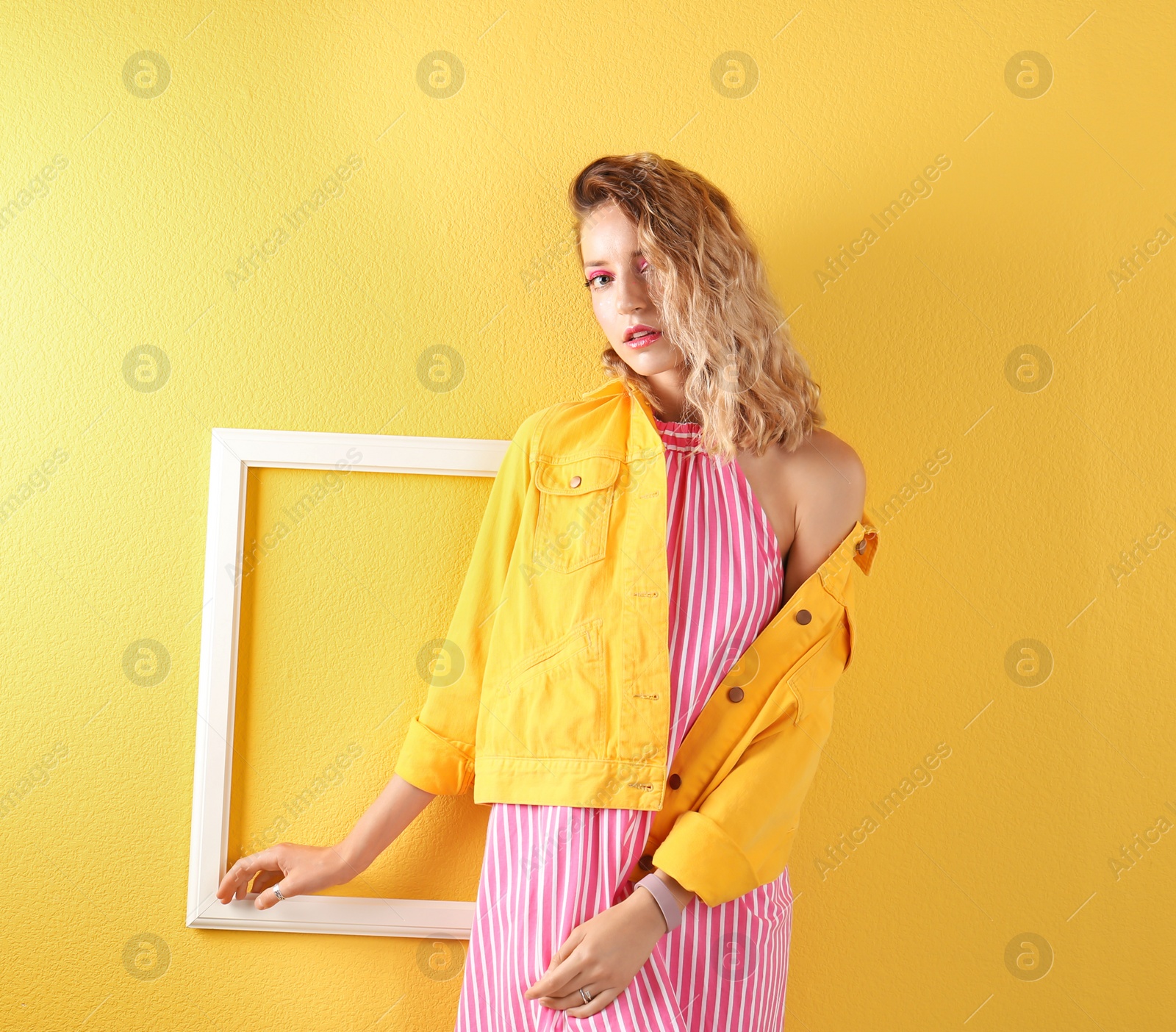 Photo of Beautiful young woman posing on color background. Summer fashion