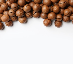 Photo of Organic Macadamia nuts on white background, top view