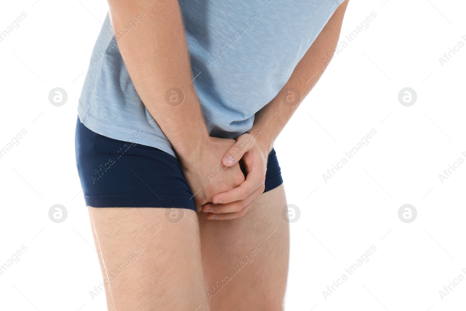 Photo of Man suffering from pain on white background, closeup. Urology problems