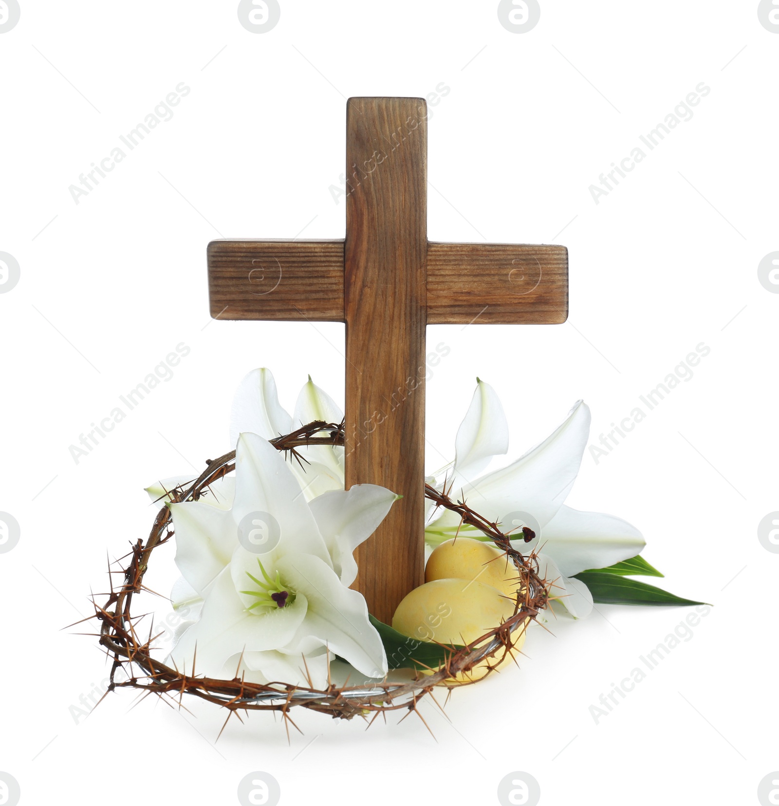 Photo of Wooden cross, crown of thorns, Easter eggs and blossom lilies on white background