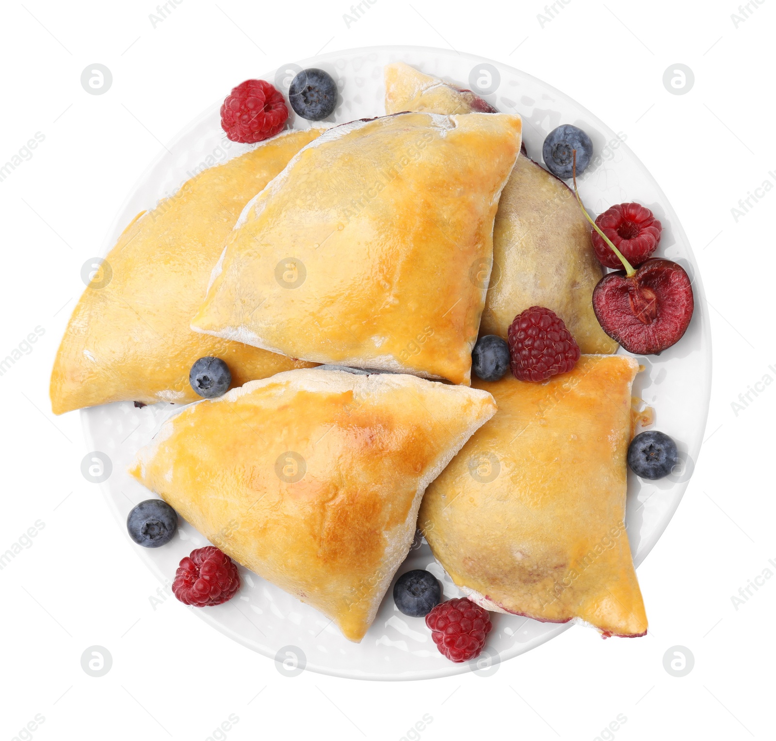 Photo of Delicious samosas with cherry and berries isolated on white, top view