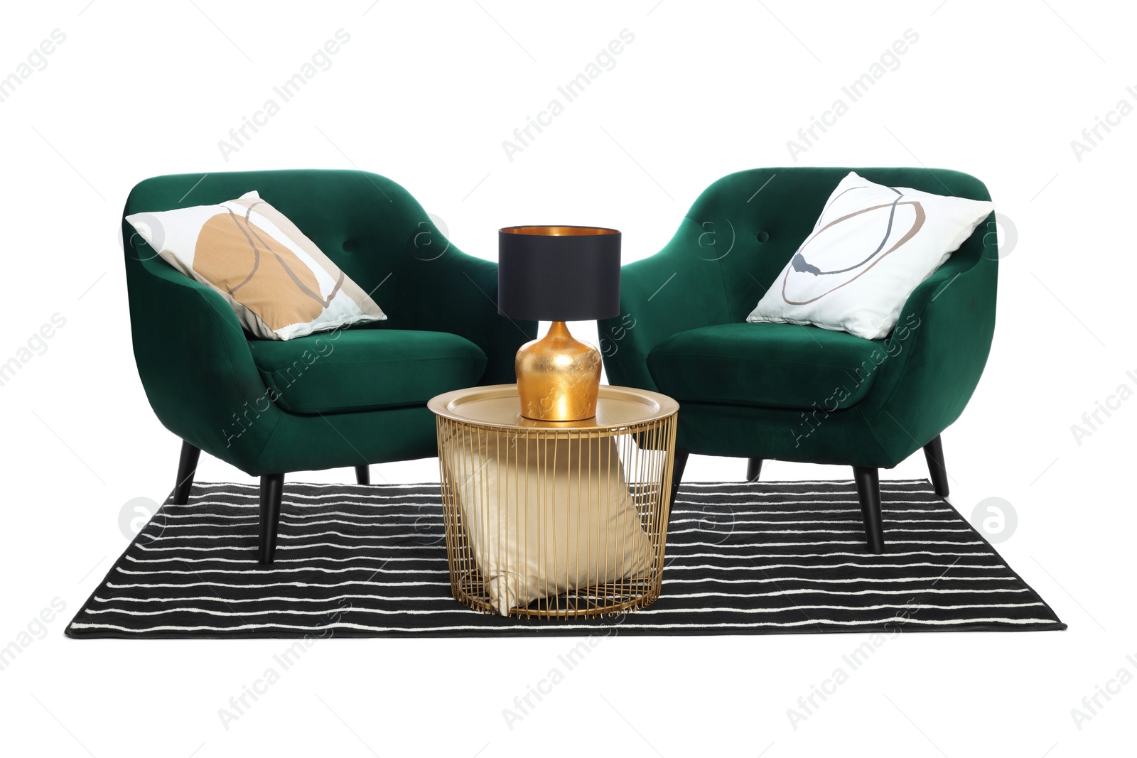 Photo of Stylish comfortable armchairs, coffee table with lamp and striped rug isolated on white